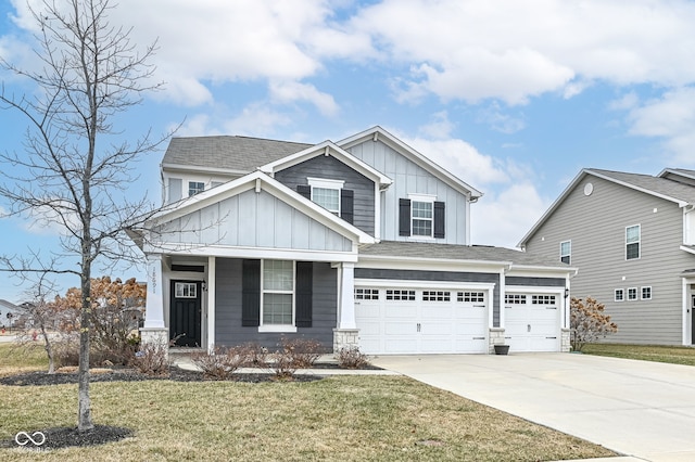 craftsman-style home with a garage and a front lawn