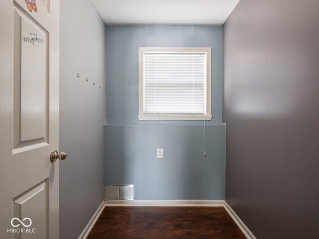 laundry area featuring dark hardwood / wood-style flooring