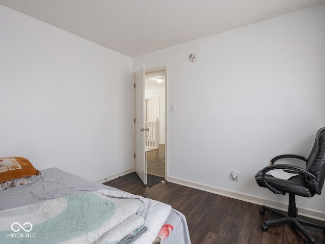 bedroom featuring dark hardwood / wood-style flooring