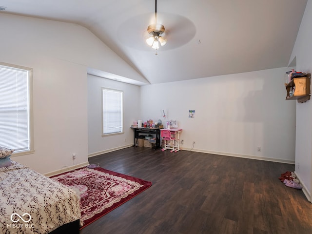 bedroom featuring lofted ceiling, multiple windows, dark hardwood / wood-style floors, and ceiling fan