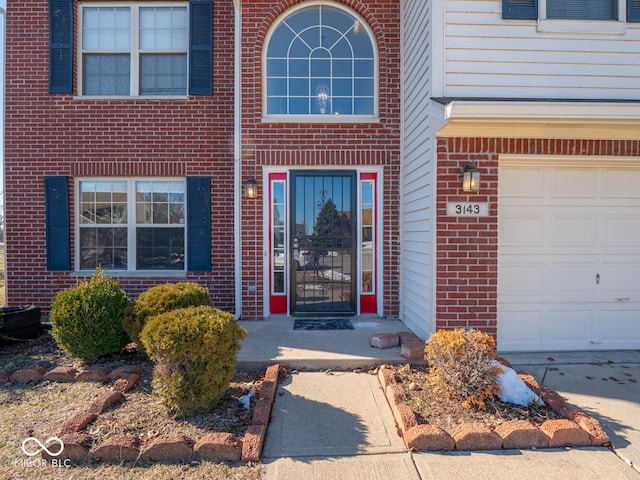 view of exterior entry featuring a garage