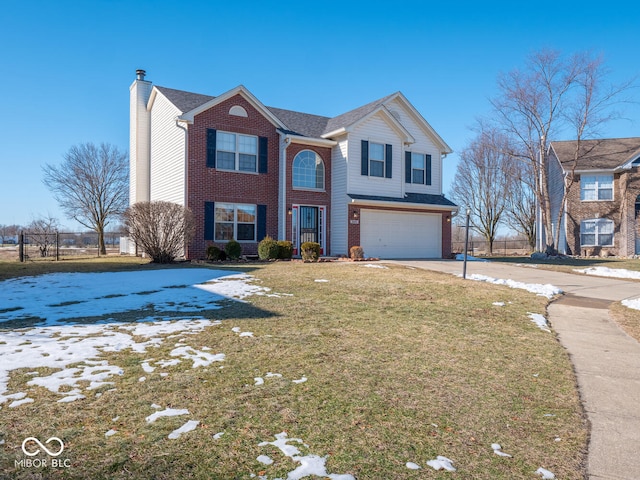 view of front of home with a yard and a garage