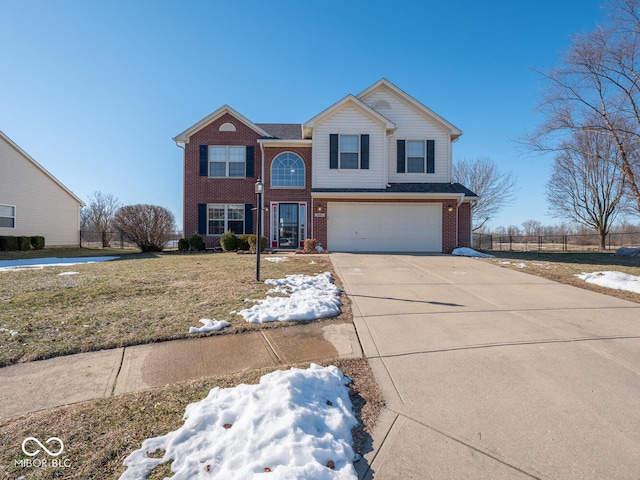 view of front property with a garage and a front lawn