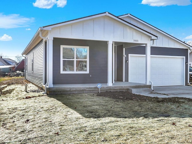 view of front of property featuring a garage and covered porch