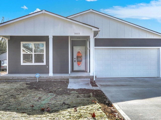 view of front of house with a garage and covered porch