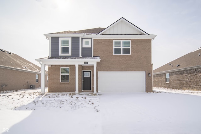 front facade featuring central AC unit and a garage