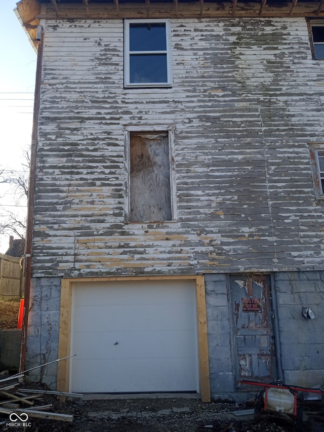 view of side of home with a garage