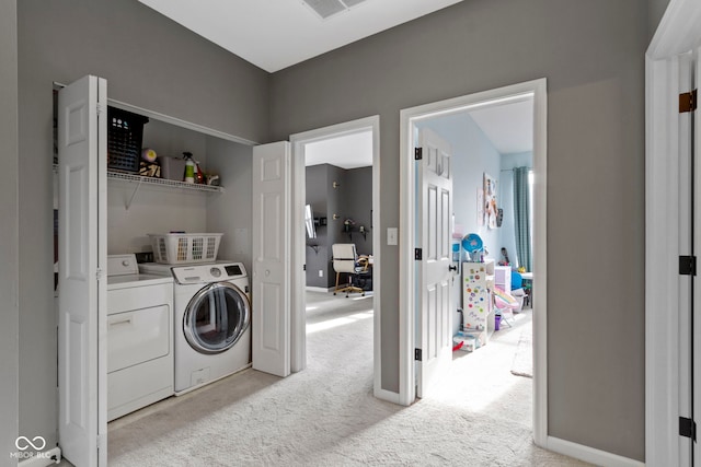 2231 Colfax Ln, Indianapolis, IN 46260 - washroom with washing machine and dryer, light carpet, and baseboards