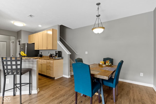 2231 Colfax Ln, Indianapolis, IN 46260 - dining area featuring wood finished floors, stairway, and baseboards