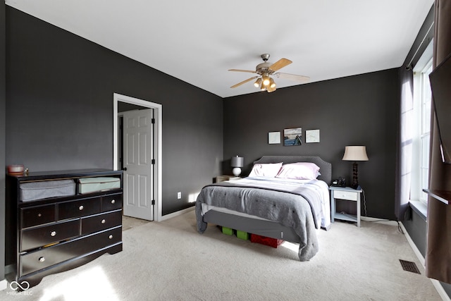 2231 Colfax Ln, Indianapolis, IN 46260 - carpeted bedroom with baseboards and ceiling fan