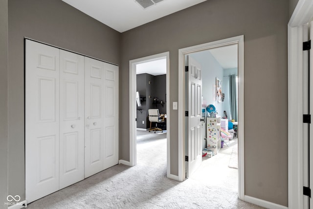 2231 Colfax Ln, Indianapolis, IN 46260 - hallway featuring carpet flooring, baseboards, and an office area