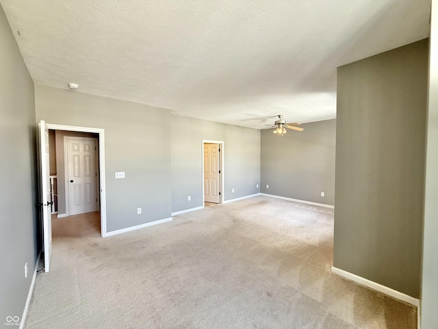 2231 Colfax Ln, Indianapolis, IN 46260 - empty room with ceiling fan, light colored carpet, a smoke detector, and a textured ceiling