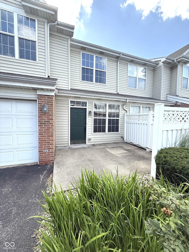 2231 Colfax Ln, Indianapolis, IN 46260 - townhome / multi-family property with a garage