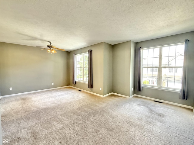 2231 Colfax Ln, Indianapolis, IN 46260 - carpeted empty room featuring a ceiling fan and a textured ceiling