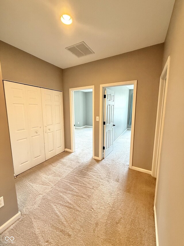 2231 Colfax Ln, Indianapolis, IN 46260 - hall featuring light carpet and recessed lighting