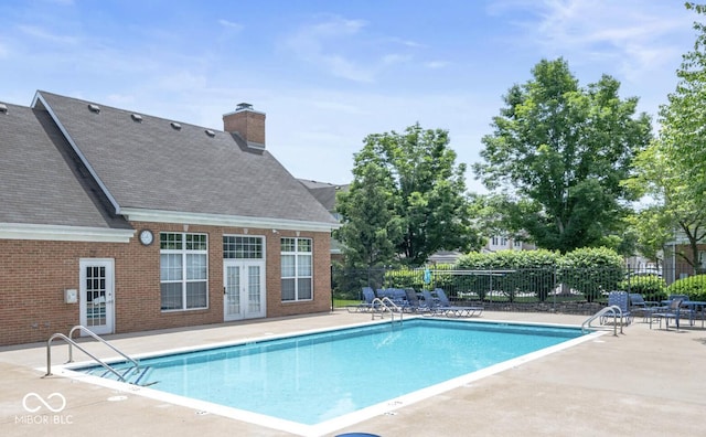 2231 Colfax Ln, Indianapolis, IN 46260 - community pool featuring a patio and french doors