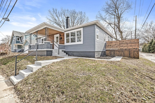 bungalow-style house featuring a chimney