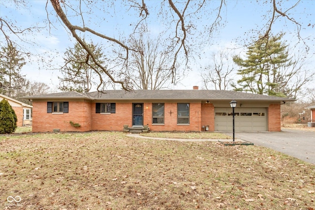 ranch-style house featuring a garage