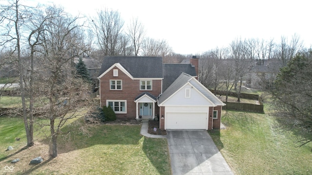 view of front facade with a garage and a front lawn