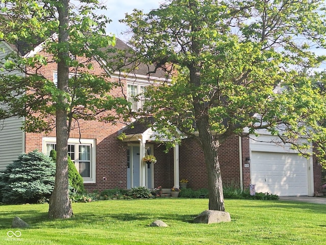 view of front of house featuring a garage and a front lawn