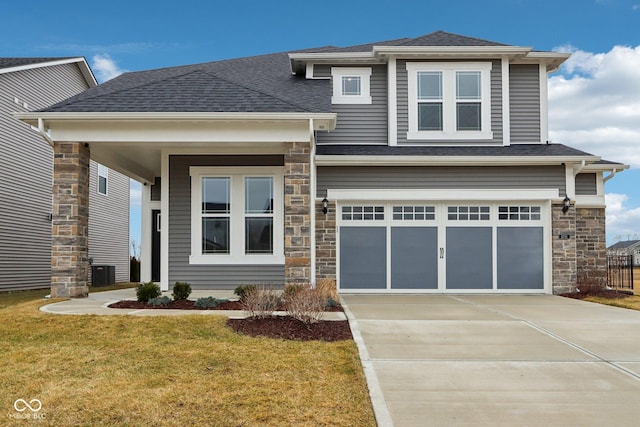 view of front facade with a garage and a front yard