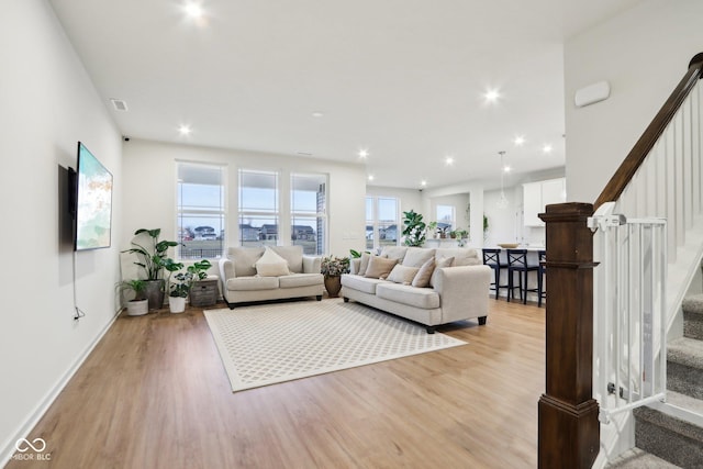 living room with light hardwood / wood-style floors