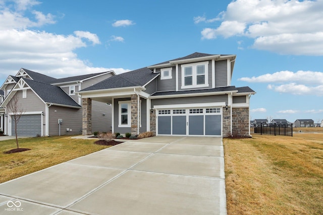 view of front of house featuring a garage and a front yard