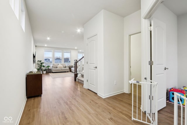 hall with light wood-type flooring