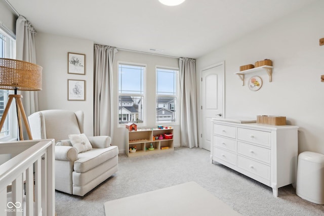 bedroom with light colored carpet