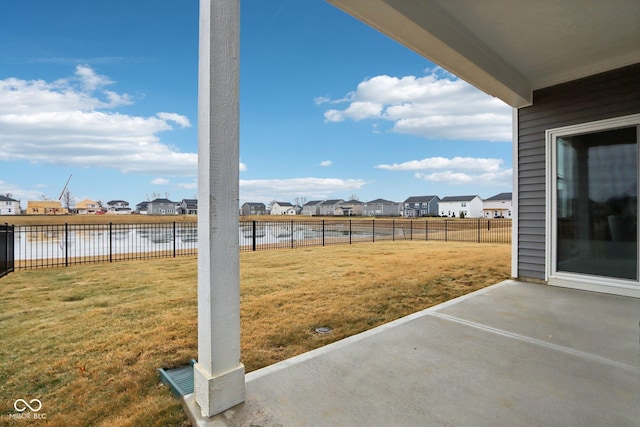 view of yard featuring a water view and a patio area