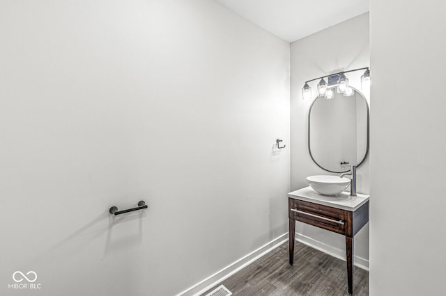 bathroom featuring vanity and wood-type flooring