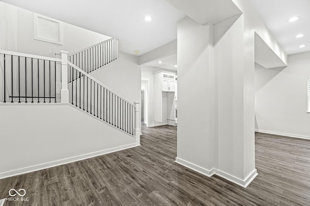 staircase featuring hardwood / wood-style flooring