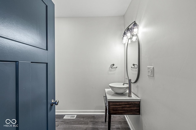 bathroom featuring hardwood / wood-style flooring and vanity