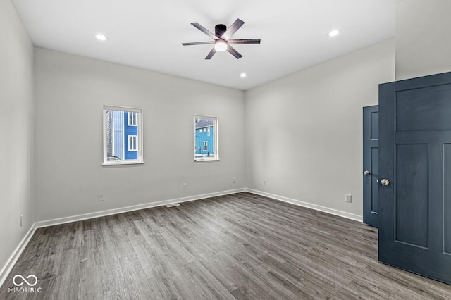 unfurnished room with hardwood / wood-style flooring and ceiling fan