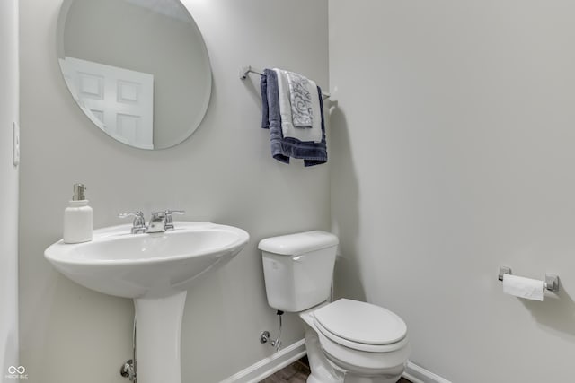 bathroom with toilet and sink