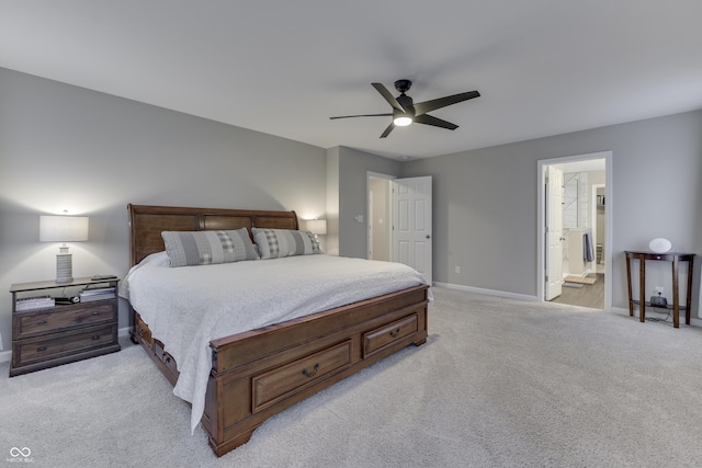 carpeted bedroom featuring ensuite bathroom and ceiling fan