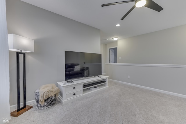 carpeted living room featuring ceiling fan