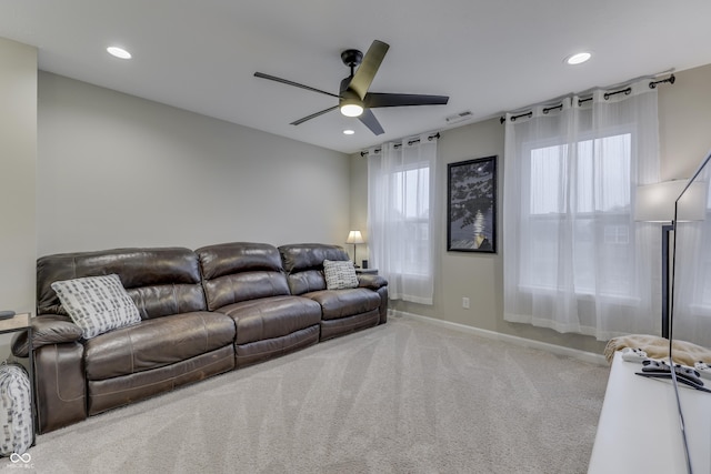 living room with carpet flooring and ceiling fan