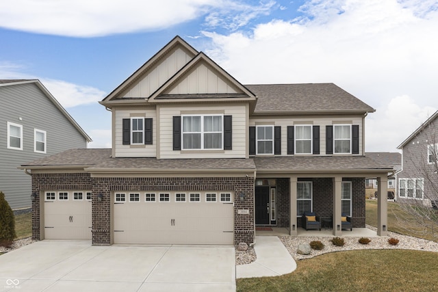 craftsman inspired home with a porch, a garage, and a front yard