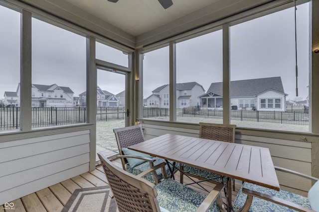 sunroom / solarium with ceiling fan