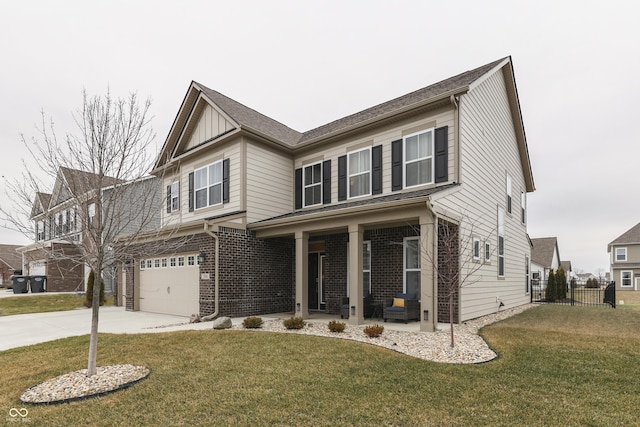 view of front of home featuring a garage, a front lawn, and a porch