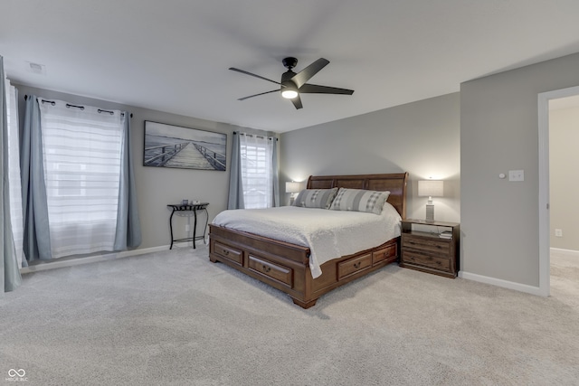 bedroom featuring light carpet and ceiling fan