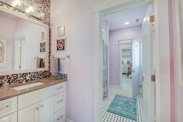 14445 Gainesway Cir, Fishers, IN 46040 - bathroom with vanity and backsplash