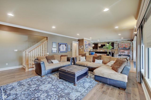 14445 Gainesway Cir, Fishers, IN 46040 - living room with light wood-style flooring, stairway, recessed lighting, and ornamental molding