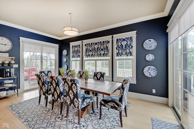 14445 Gainesway Cir, Fishers, IN 46040 - dining space featuring plenty of natural light, light wood-style flooring, and ornamental molding