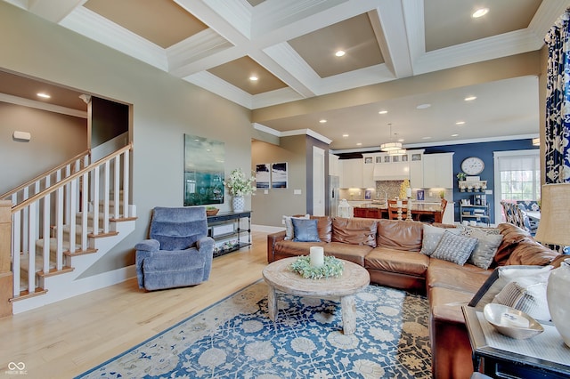 14445 Gainesway Cir, Fishers, IN 46040 - living room featuring ornamental molding, light wood-style floors, beamed ceiling, stairway, and coffered ceiling