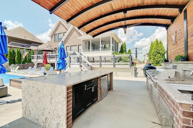 14445 Gainesway Cir, Fishers, IN 46040 - view of patio / terrace featuring exterior kitchen, a sunroom, and a ceiling fan