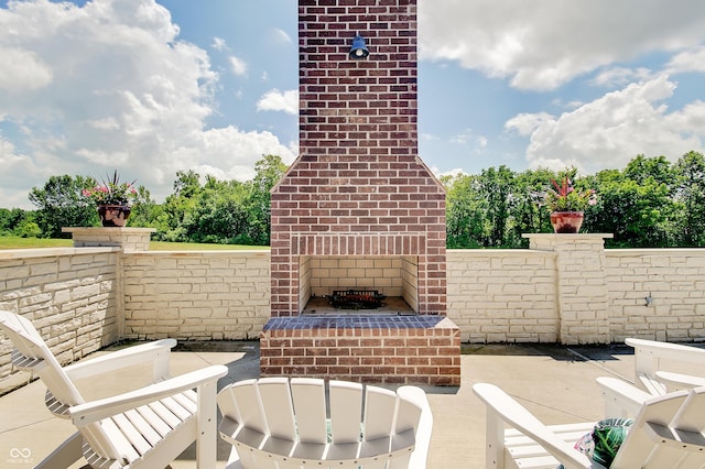 14445 Gainesway Cir, Fishers, IN 46040 - view of patio featuring an outdoor brick fireplace