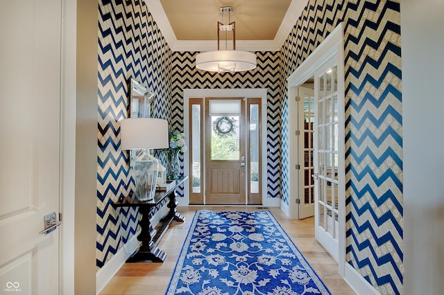 14445 Gainesway Cir, Fishers, IN 46040 - foyer with ornamental molding, wallpapered walls, and light wood finished floors