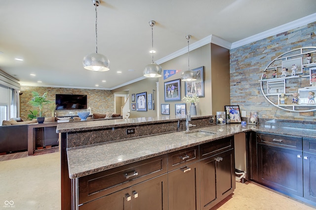 14445 Gainesway Cir, Fishers, IN 46040 - kitchen featuring ornamental molding, stone counters, dark brown cabinets, hanging light fixtures, and open floor plan